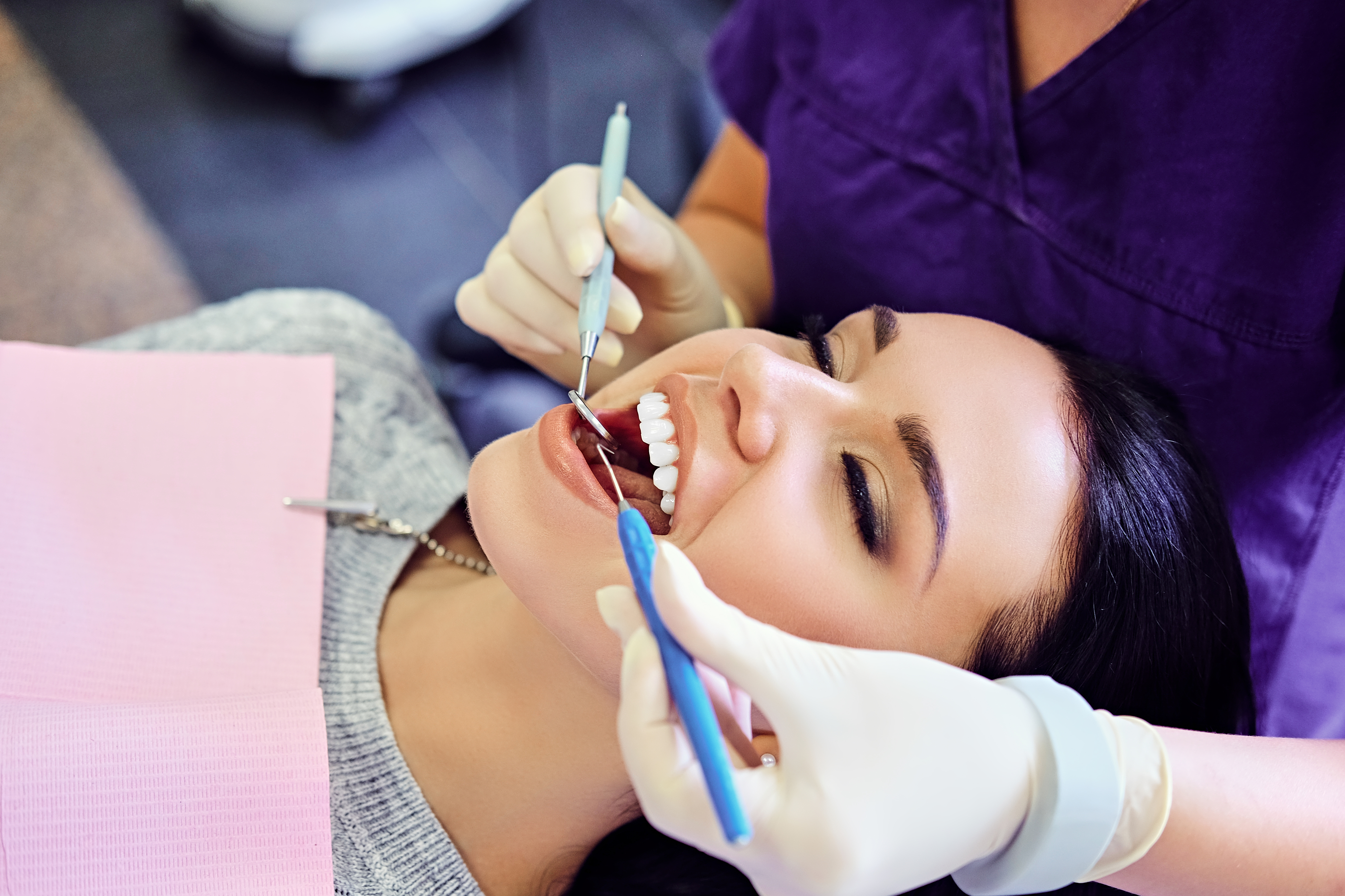 Happy patient smiling in dental chair